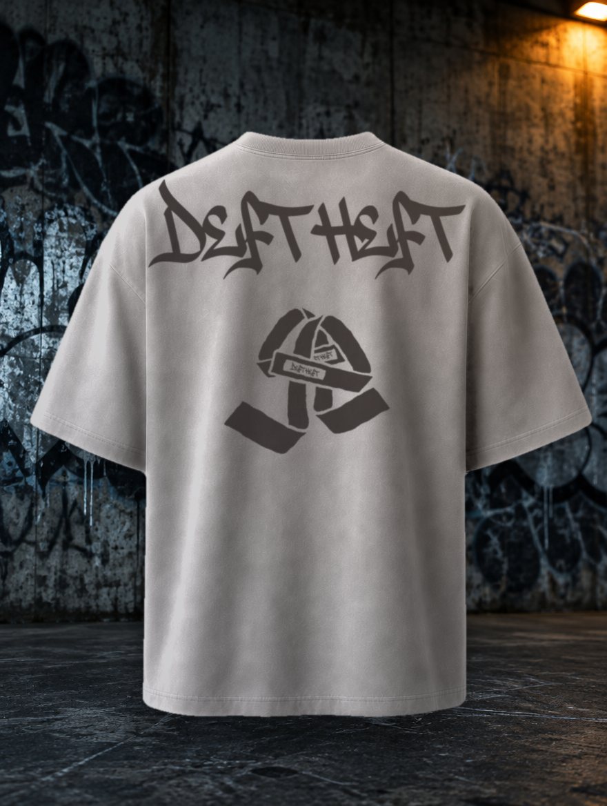 Oversized tee in Washed Chalk seen from the back, with the Deft Heft wordmark and a crossed pair of lifting straps. Concept render.